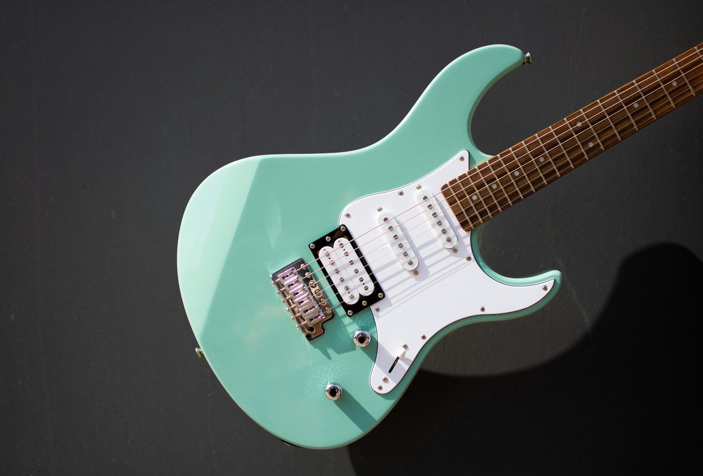 Custom electric guitar with a light green body